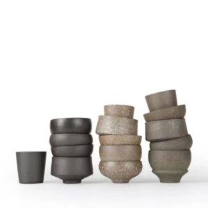 group display of multiple handcrafted chinese ceramic clay teacups assorted sizes blue and white