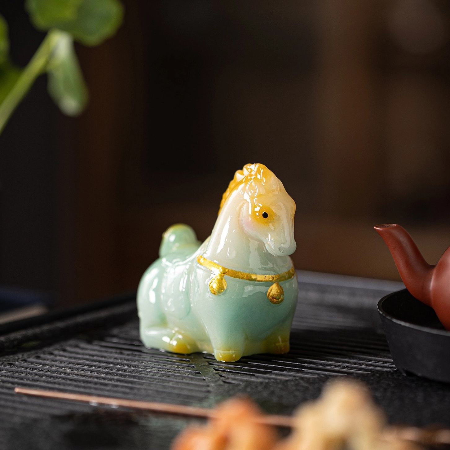 back view of handcrafted dehua resin horse tea pet
