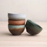 Collection of five handcrafted vintage ceramic chawan tea bowls in different earthy tones