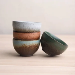 Collection of five handcrafted vintage ceramic chawan tea bowls in different earthy tones
