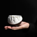 Full view of handcrafted gold speckled ceramic chawan tea bowl