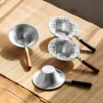 collection of four handcrafted loose leaf tea strainer spoons with wooden handles