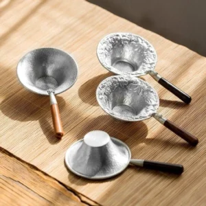 collection of four handcrafted loose leaf tea strainer spoons with wooden handles