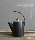 handmade black ceramic teapot with natural stone lid
