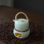 complete handmade ceramic teapot and candle warmer stove set in light green