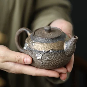 full product view of handmade coarse pottery plum blossom 200ml teapot