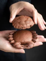 full view of handmade purple clay crab loose leaf tea strainer with tea pet base