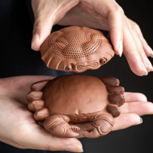 full view of handmade purple clay crab loose leaf tea strainer with tea pet base