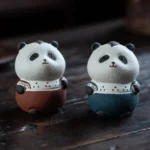 Handmade purple clay panda tea pet on wooden tea table