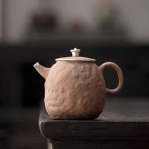 front view of handmade stone shaped 220ml Jingdezhen coarse pottery gongfu teapot with silver accents