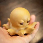 handmade yixing zisha sassy octopus tea pet on wooden tea tray main product view