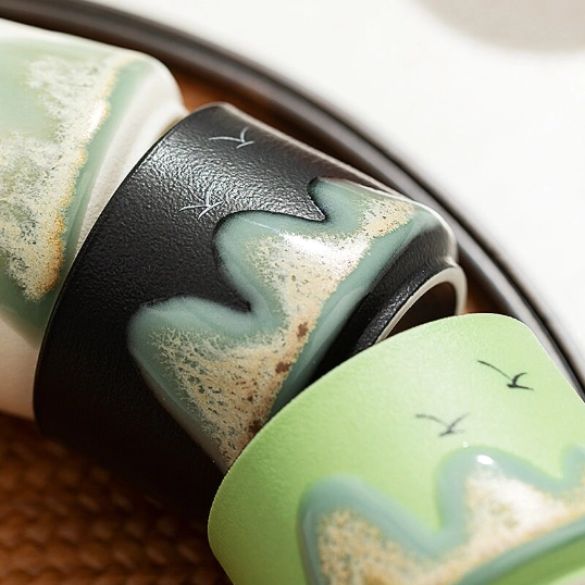 close up of four mixed color 70ml ink mountain ceramic gongfu tea cups