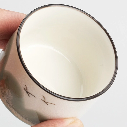 four 70ml ink mountain ceramic gongfu tea cups arranged on wood background