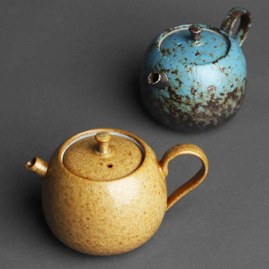 Top down view of iron rust glaze teapot showing spout and handle