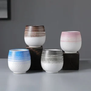 collection of four colored japanese style handcrafted ceramic teacups