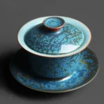 Full view of handcrafted blue Jun Yao Gaiwan tea set with red lid knob