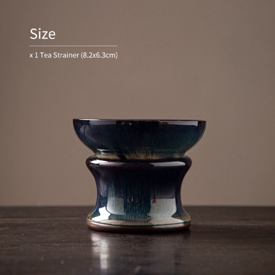 jian ware tea strainer resting on its matching ceramic base