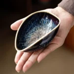 Handcrafted kiln-changed blue white ceramic tea scoop cha he front view