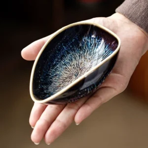 Handcrafted kiln-changed blue white ceramic tea scoop cha he front view