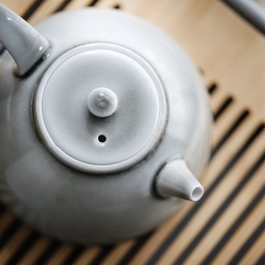 close up of vent hole on celadon teapot lid