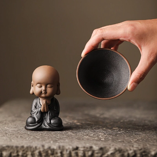 little monk loose leaf tea strainer with hat removed showing strainer function