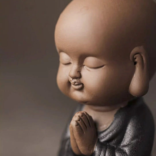 little monk loose leaf tea strainer resting on tea table as decor