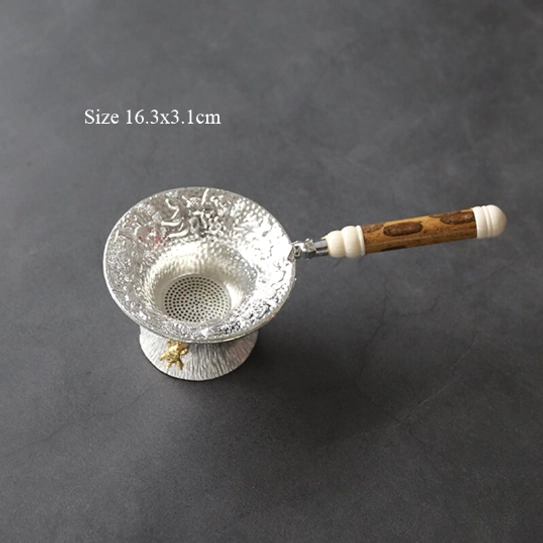 close-up of the embossed goldfish pattern on this loose leaf tea strainer