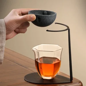 porous loose leaf tea strainer with black metal stand full view