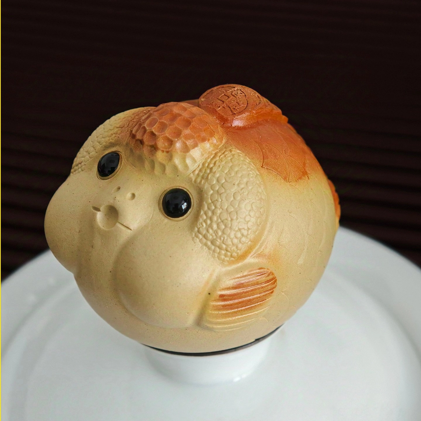 lucky fish tea pet placed on gongfu tea ceremony tea tray