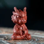 front view of handcrafted meditating chinese dragon clay tea pet