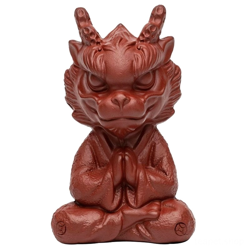 full side profile of reddish brown clay meditating dragon tea pet