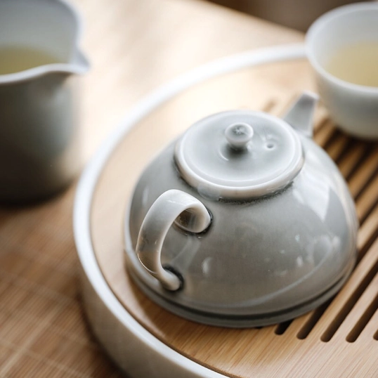 side profile view of 200ml minimalist celadon ceramic teapot