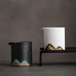 Handcrafted mountain ceramic Gong Dao Bei pouring tea into a teacup