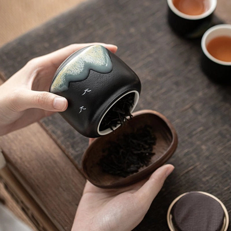 Open ceramic tea jar showing interior space for storing loose leaf tea
