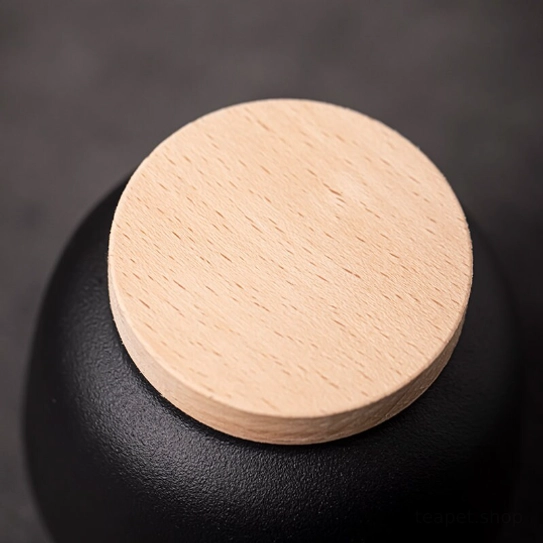 open ceramic tea jar filled with loose leaf tea