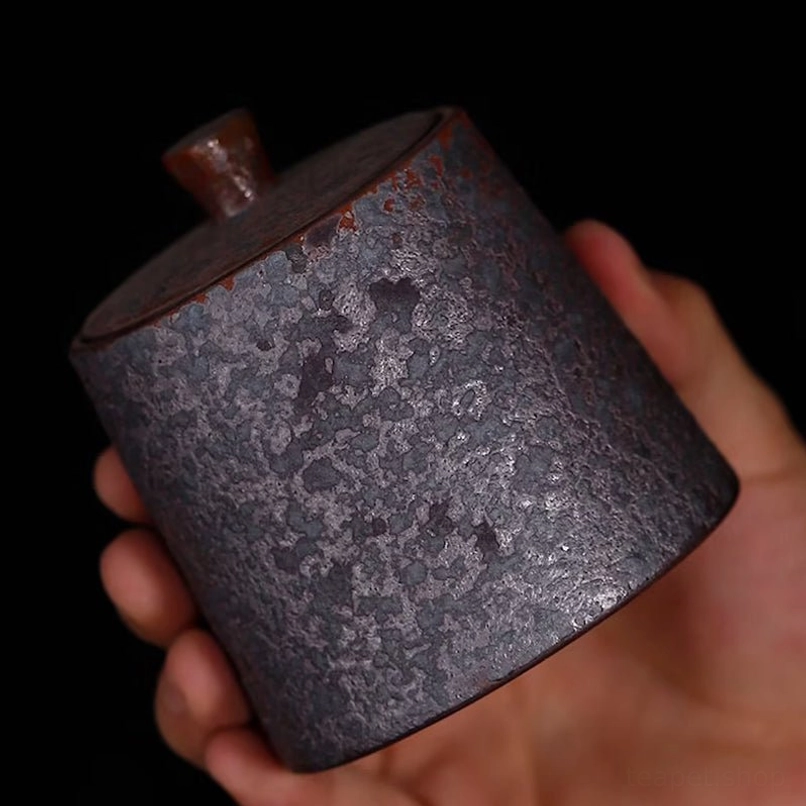 open vintage tea jar showing inner sealing structure