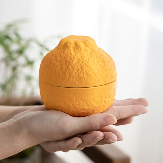 ceramic orange loose leaf tea strainer bottom base view