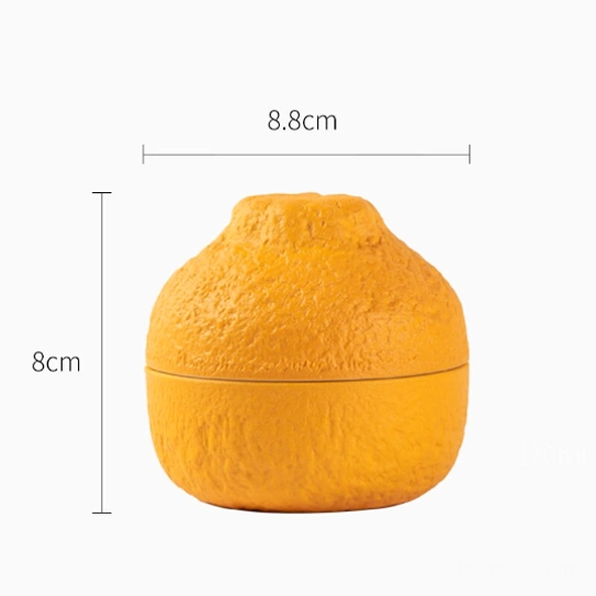 close up of orange peel texture on ceramic loose leaf tea strainer