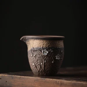 Hand-carved plum blossom coarse pottery Gong Dao Bei tea pitcher 280ml side view