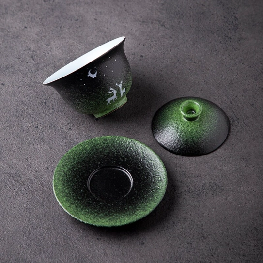 close up of the white deer and moon pattern on the porcelain gaiwan