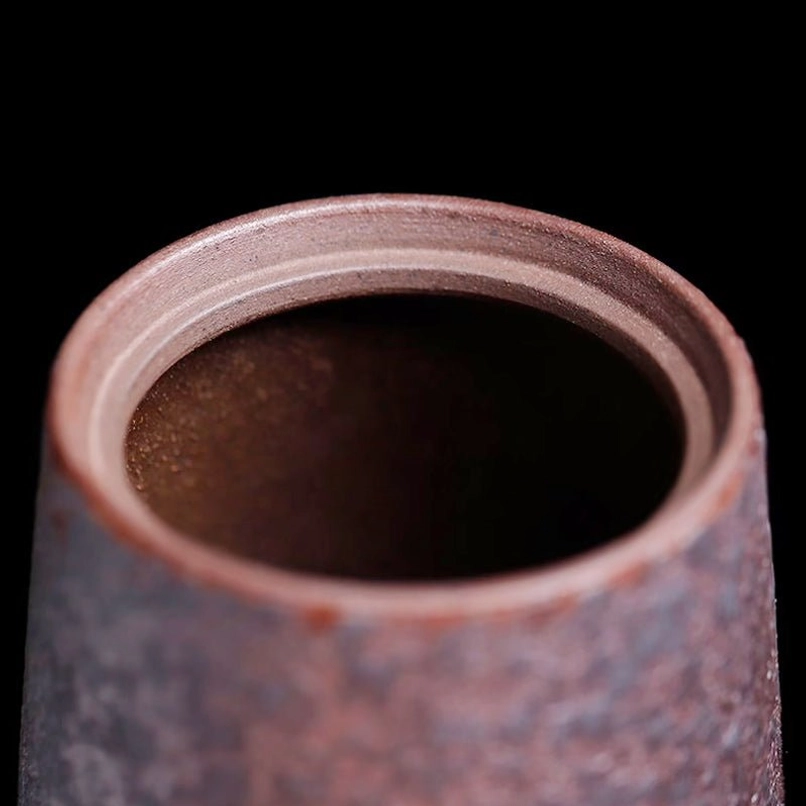 compact portable vintage tea jar held in hand to show size