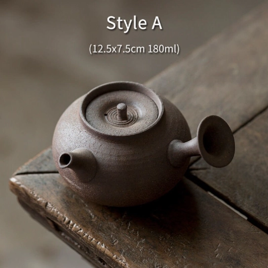 pouring brewed tea from handcrafted kyusu teapot into cup