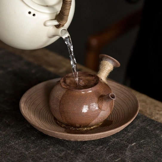 pouring hot water into 180ml kyusu side handle teapot