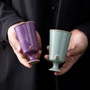 handcrafted purple textured glaze chinese high foot ceramic teacup side view