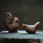 Main view of 2-piece handcrafted Yixing purple clay rooster and hen tea pet set