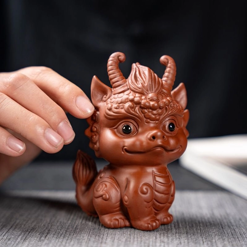 qilin dragon tea pet on tea tray with tea set
