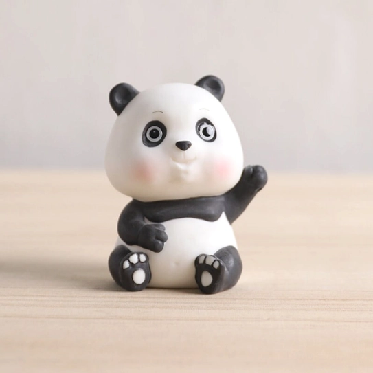 closeup side view of reclining panda tea pet with hand-painted pink blush detail