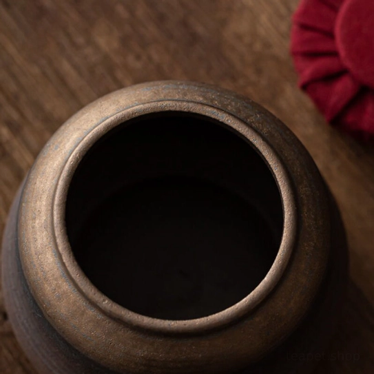 Top view of red fabric lid for ceramic tea storage jar
