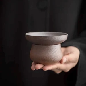 handmade rustic ceramic loose leaf tea strainer with matching base full view