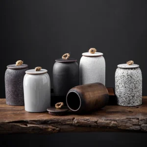 handcrafted rustic ceramic tea jar with lid open showing fabric seal